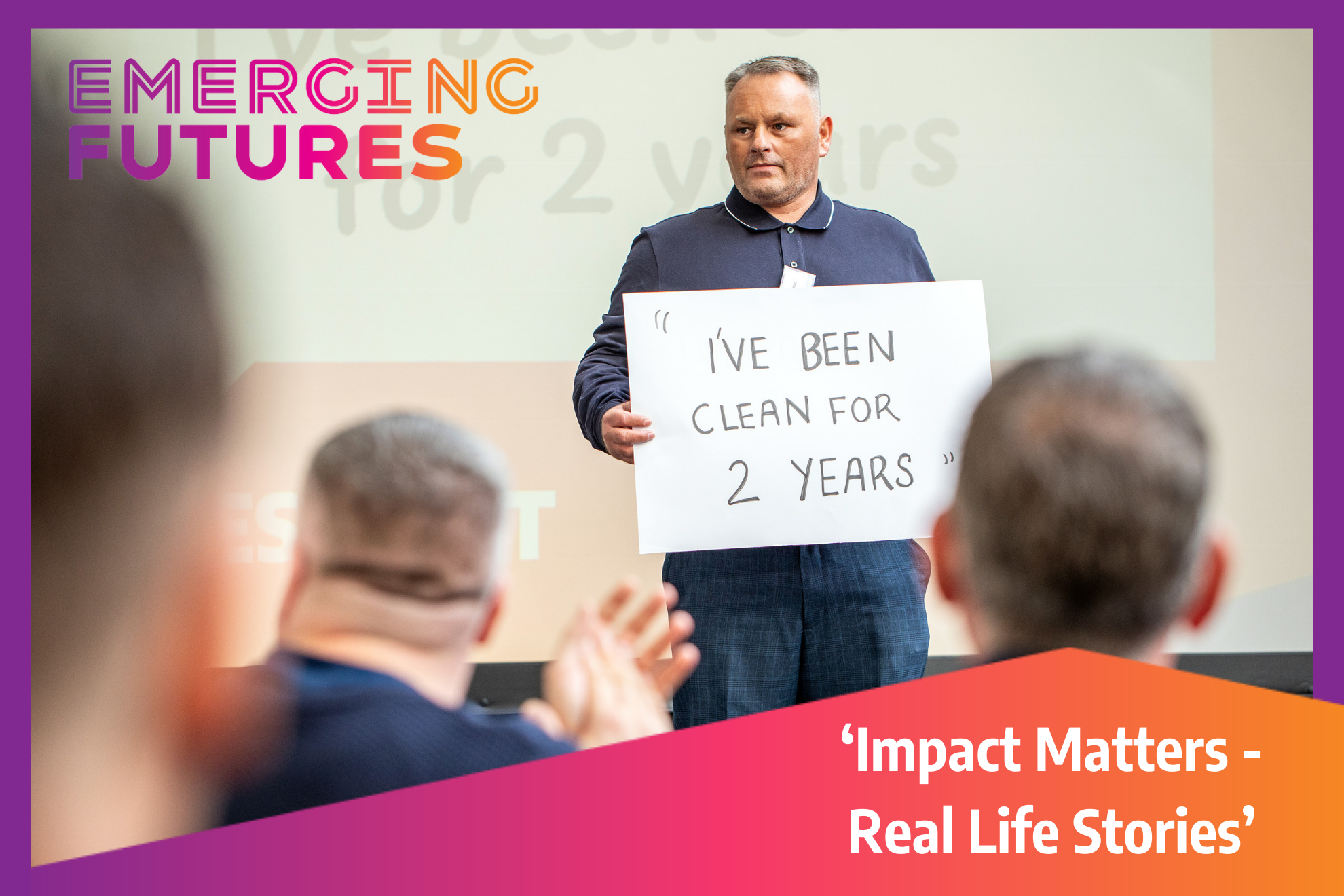 A man holds a sign that says "I've Been Clean for 2 years"