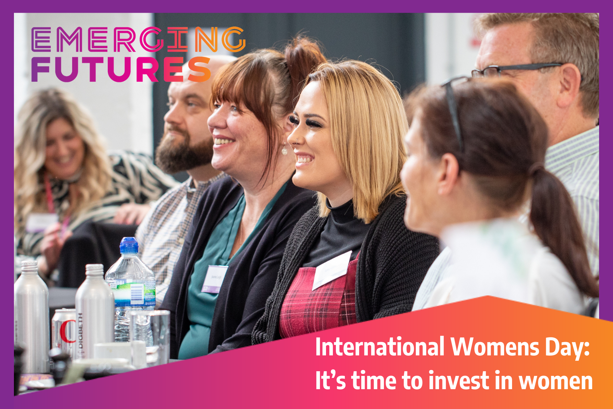 A group of women at a conference smiling