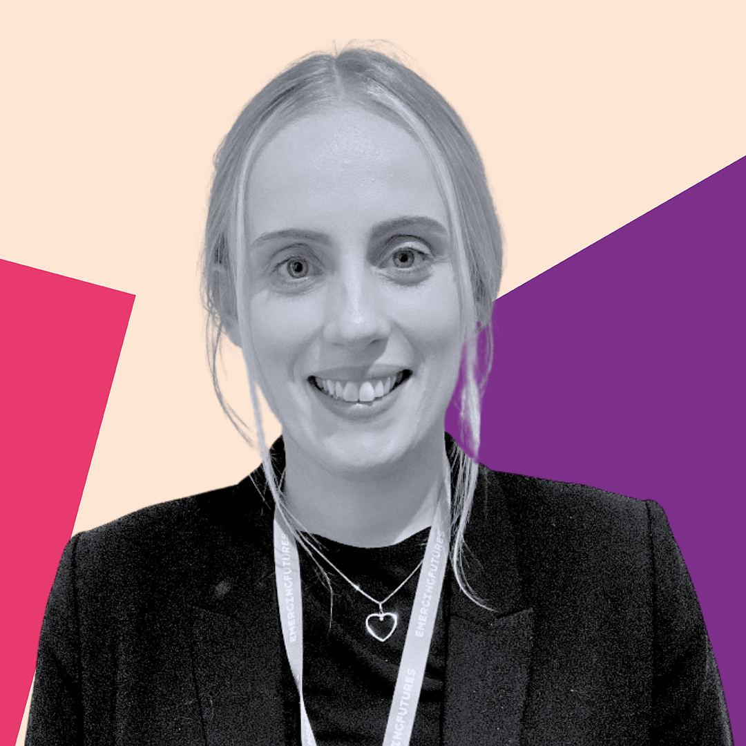 Amelia Welsh in a black blazer with an Emerging Futures lanyard