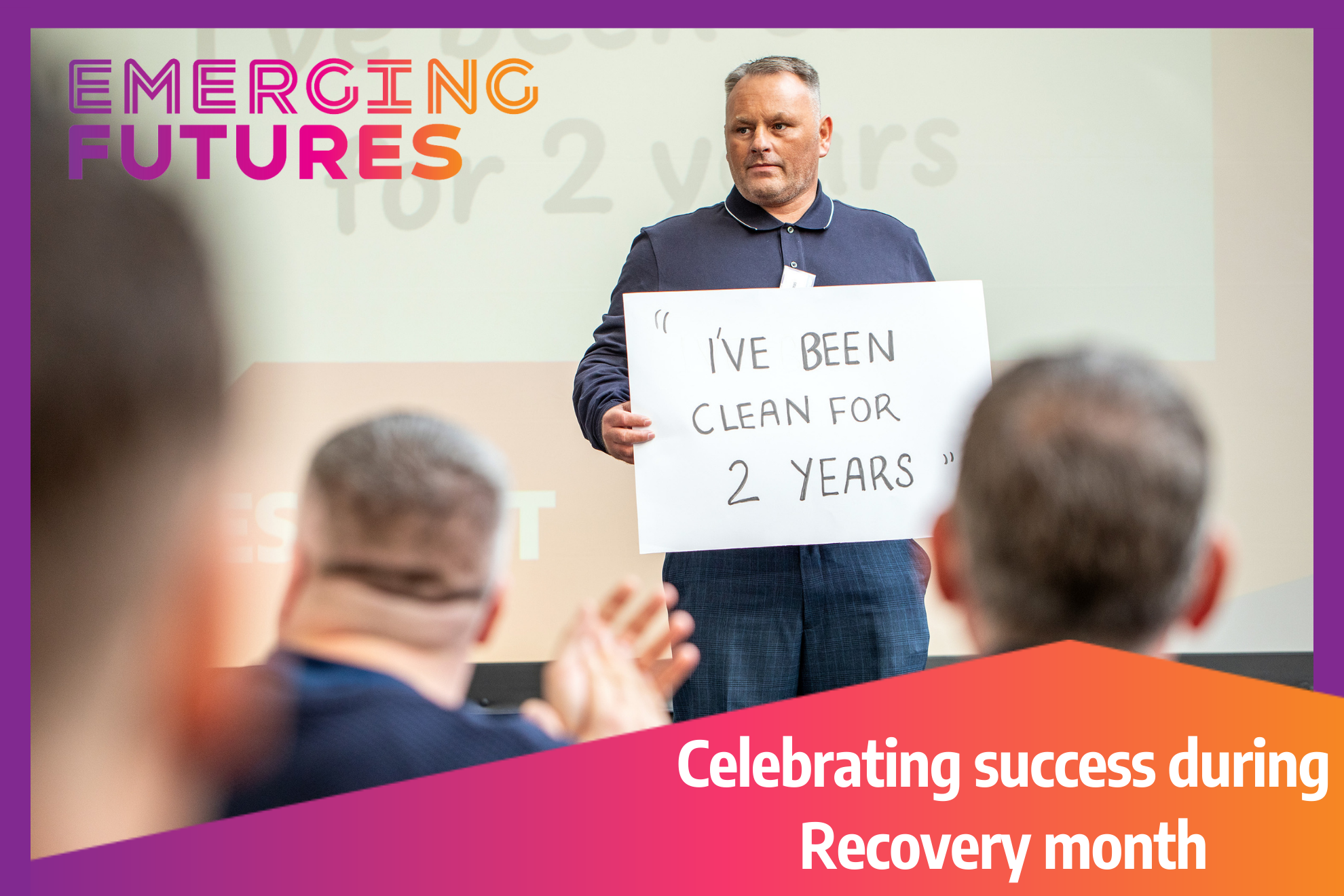 A man standing in front of people holding a sign reading, "I've been clean for 2 years." Text overlay reads, "Celebrating success during Recovery Month."