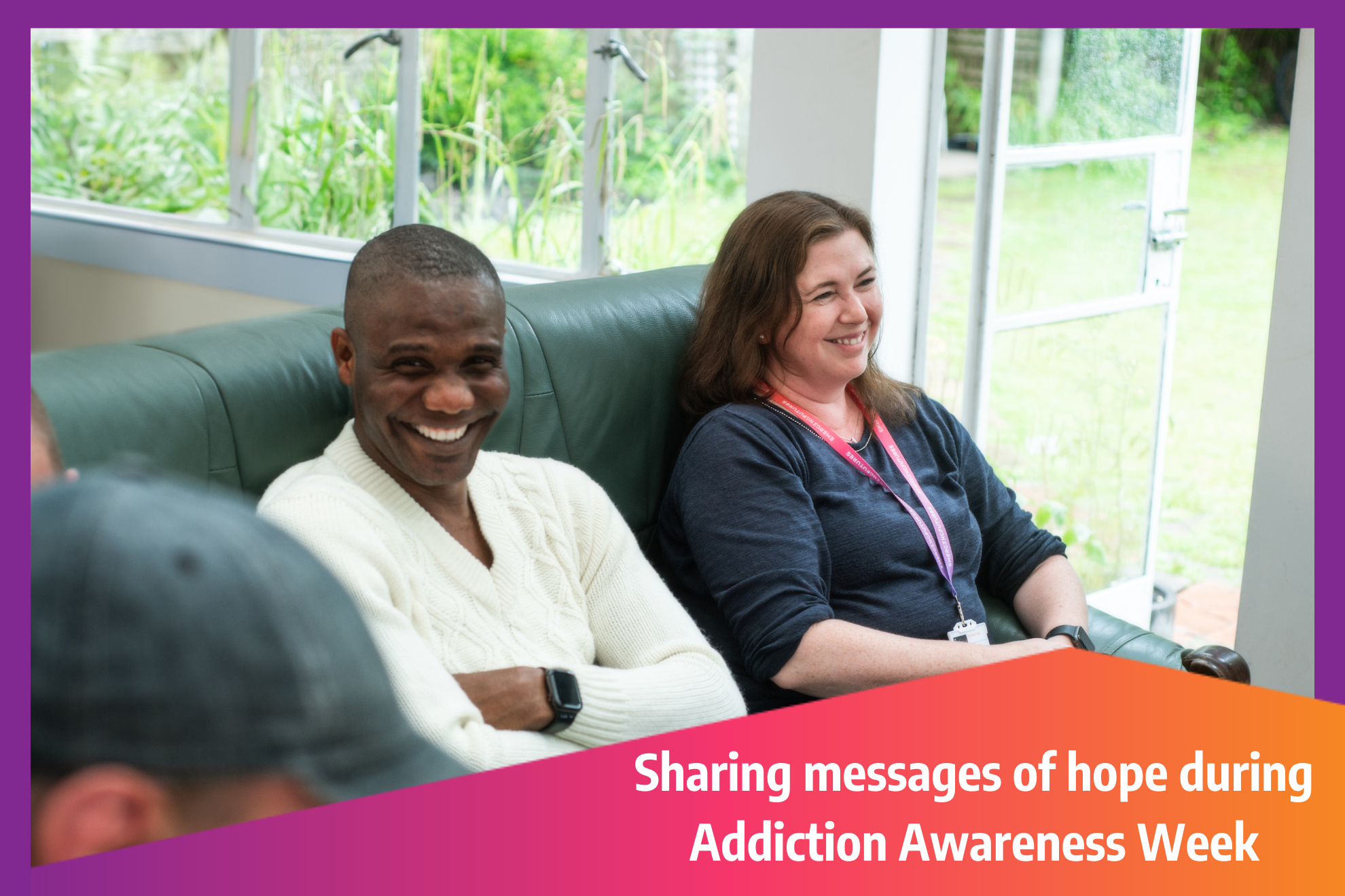 Smiling lady and man sitting on a sofa. Text overlay reads, "Sharing messages of hope during Addiction Awareness Week."