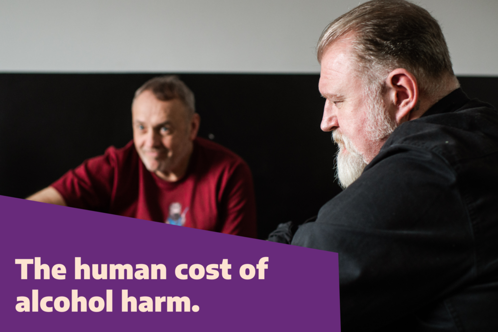 Side profile of a man with a beard in a black shirt. Text overlay reads, "The human cost of alcohol harm."