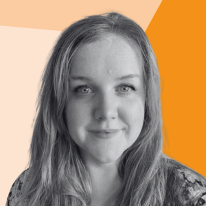 Black-and-white head-and-shoulders portrait of a person with long hair, looking towards the camera, set against a geometric background in shades of cream and orange.